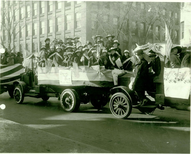 Women participating in an Armistice Day parade.